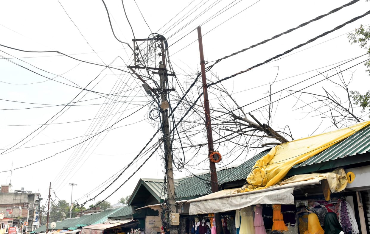 Thinking in government papers and meetings, wires entangled on the ground