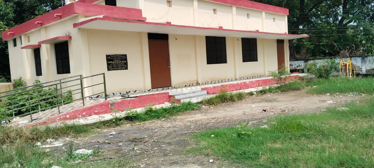 The multipurpose hall remained locked, students play in front of the school