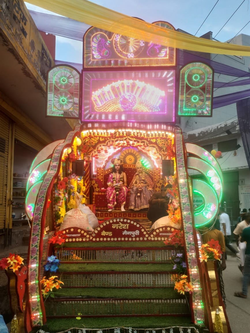 Temple and city illuminated in devotion to Laddu Gopal