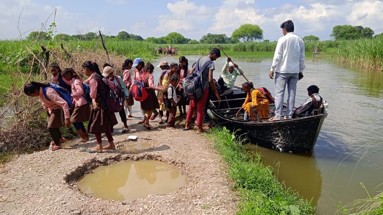 The water level of Saryu river has reduced a bit, boats are still running on the connecting road