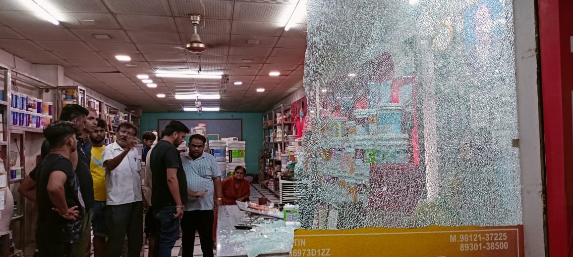 Miscreants in a car opened fire at a paint shop