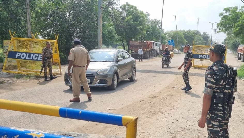 Paramilitary forces and police check vehicles by setting up checkpoints.