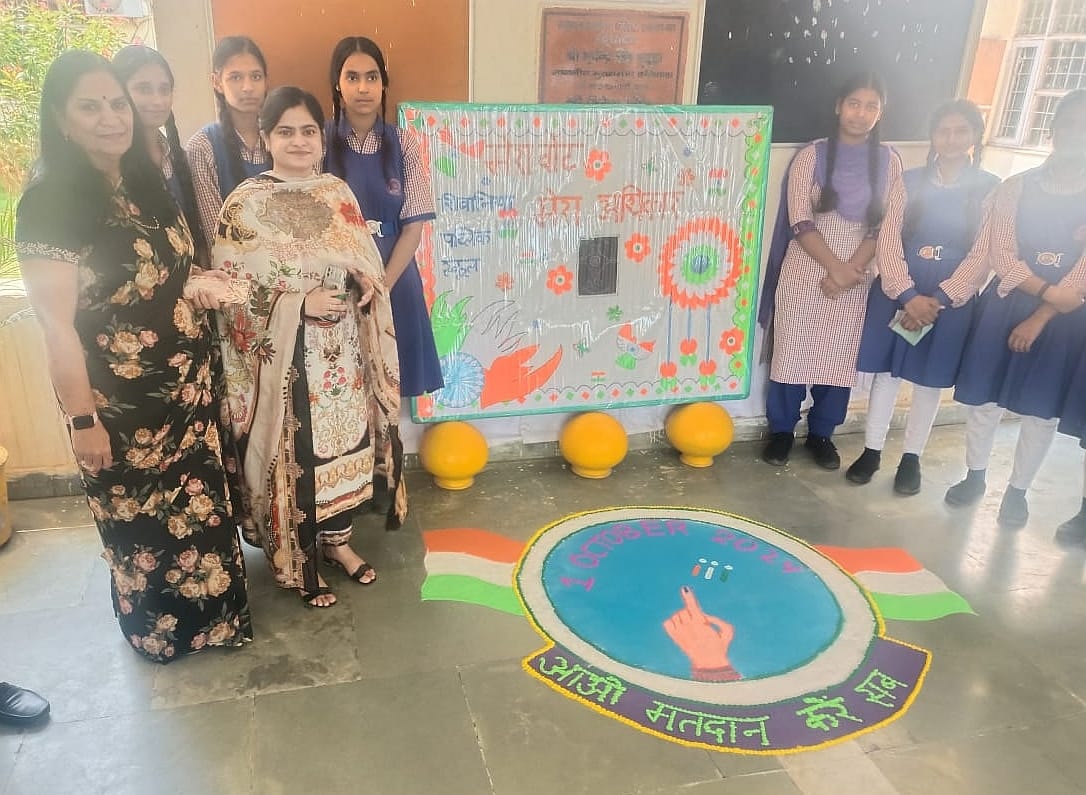 Creating awareness about voting by making Rangoli