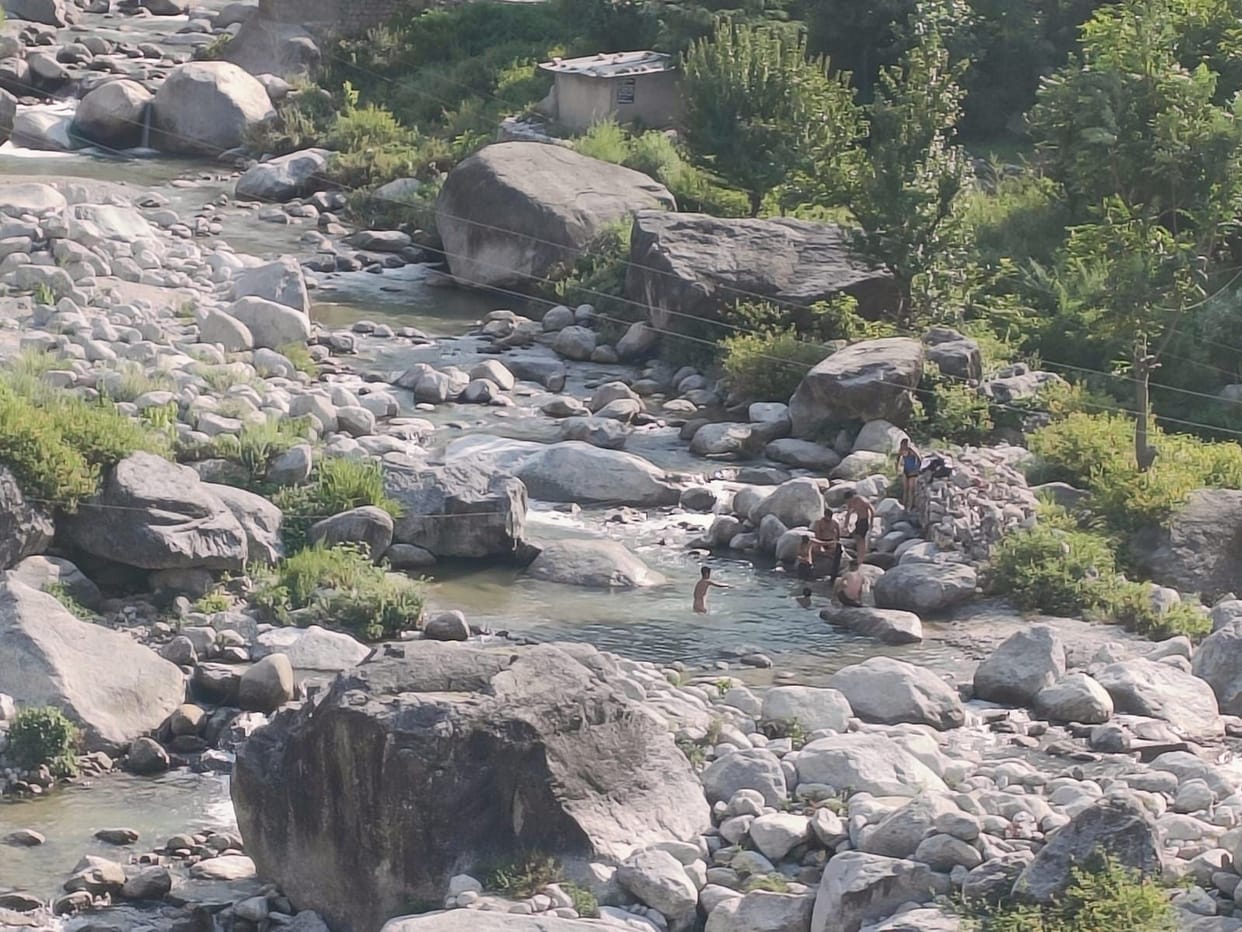 Youths are risking their lives while bathing in Mahela Khad.