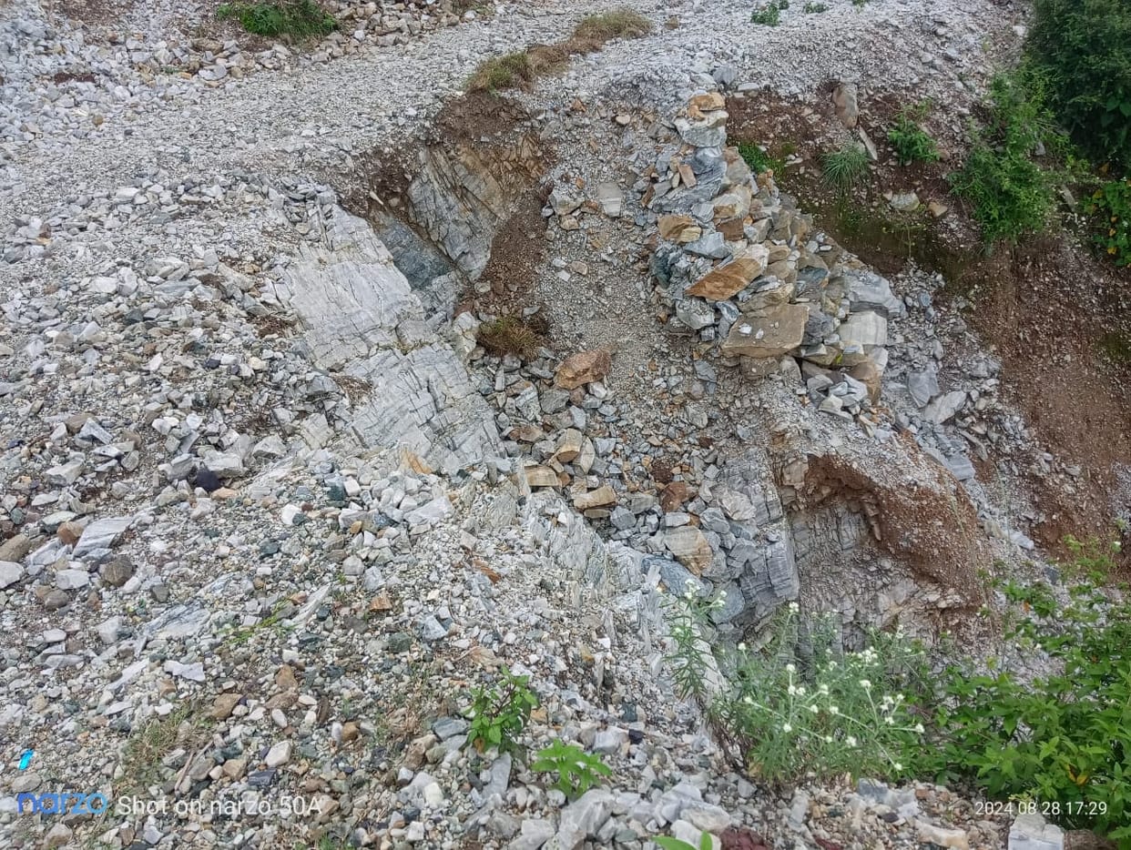 Road damaged, villagers of Digli forced to carry goods on their backs for five kilometers
