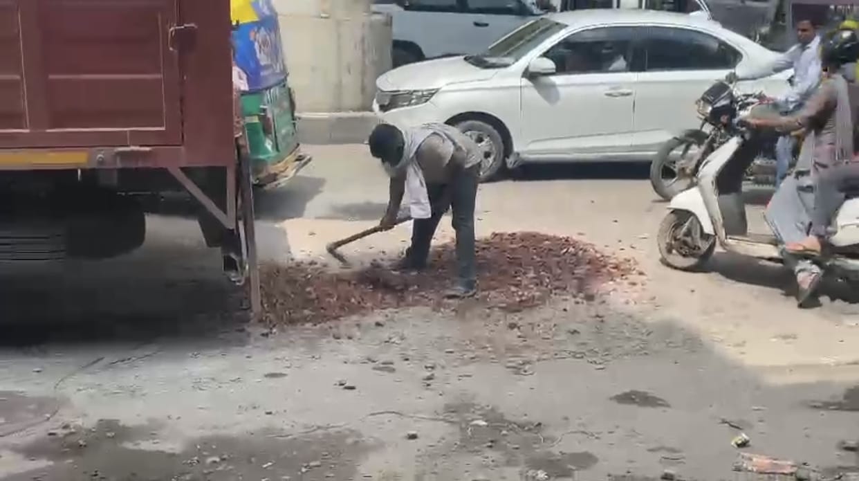Work started to repair potholes in the road