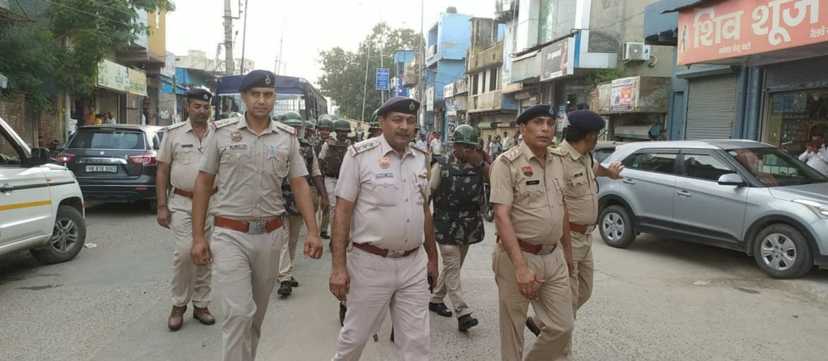 Police and army personnel took out flag march
