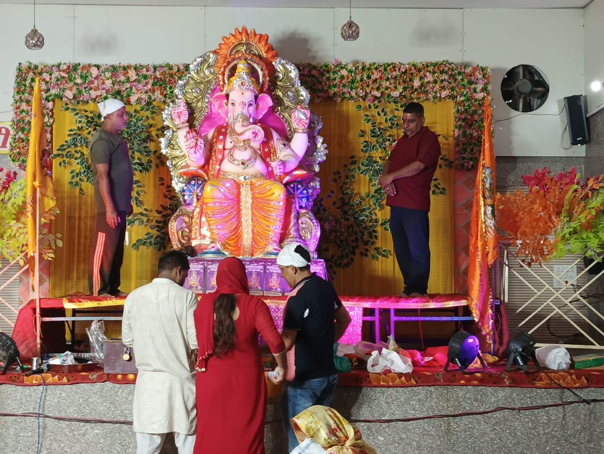 Devotees gathered to see the forms of Bappa