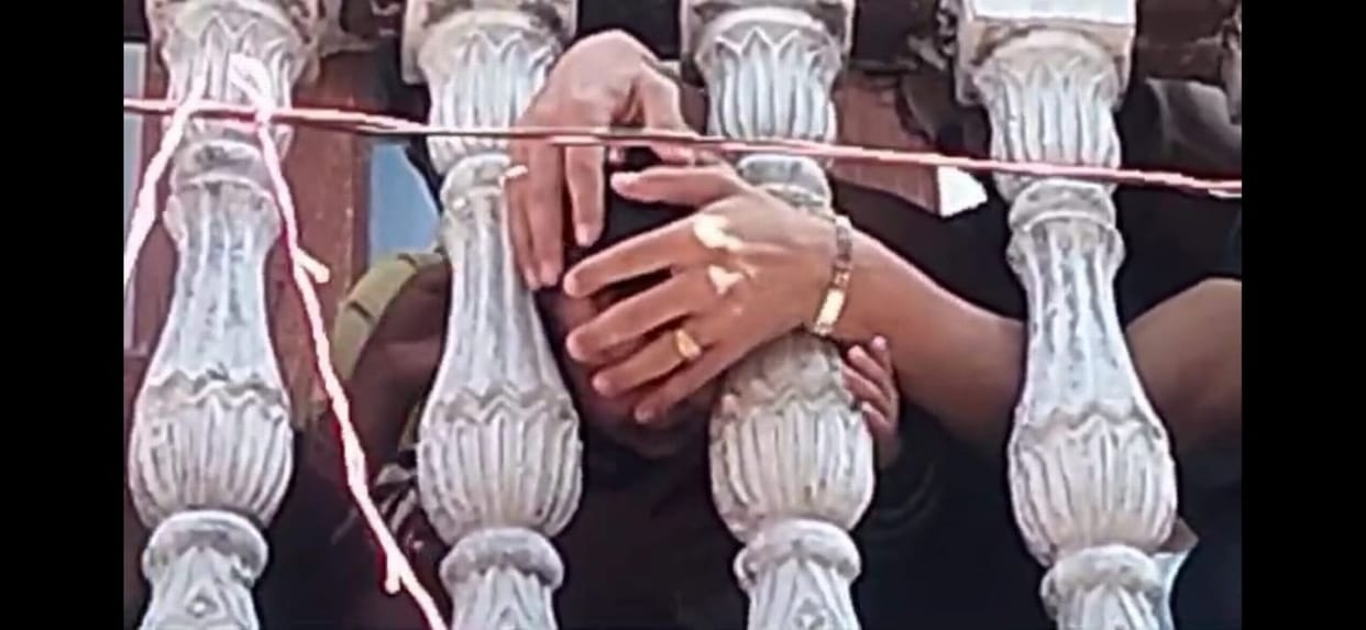 When a devotee child's head got stuck, the cement railing had to be broken.
