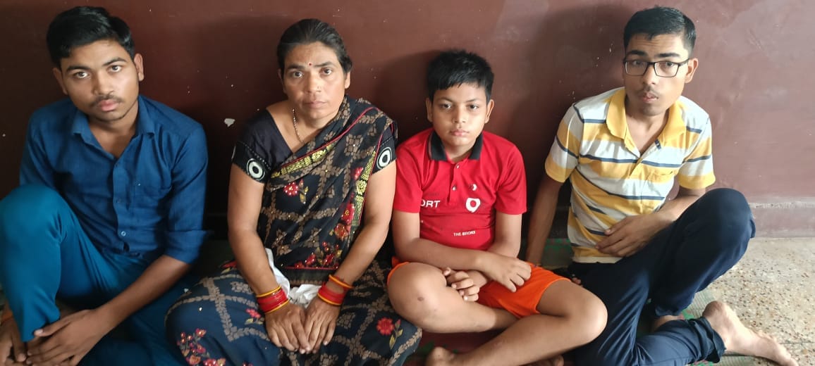 Women along with children sit on dharna