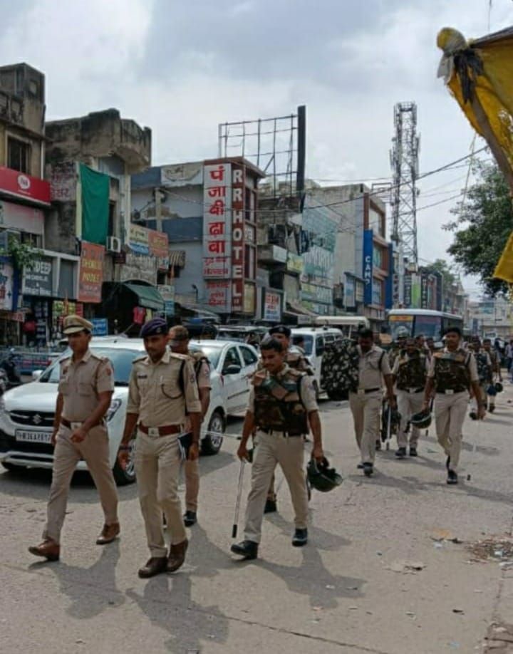 Police assured security by conducting flag march