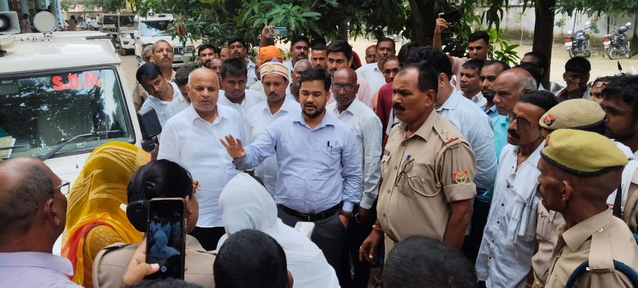 Protested by lying down in front of SDM's vehicle