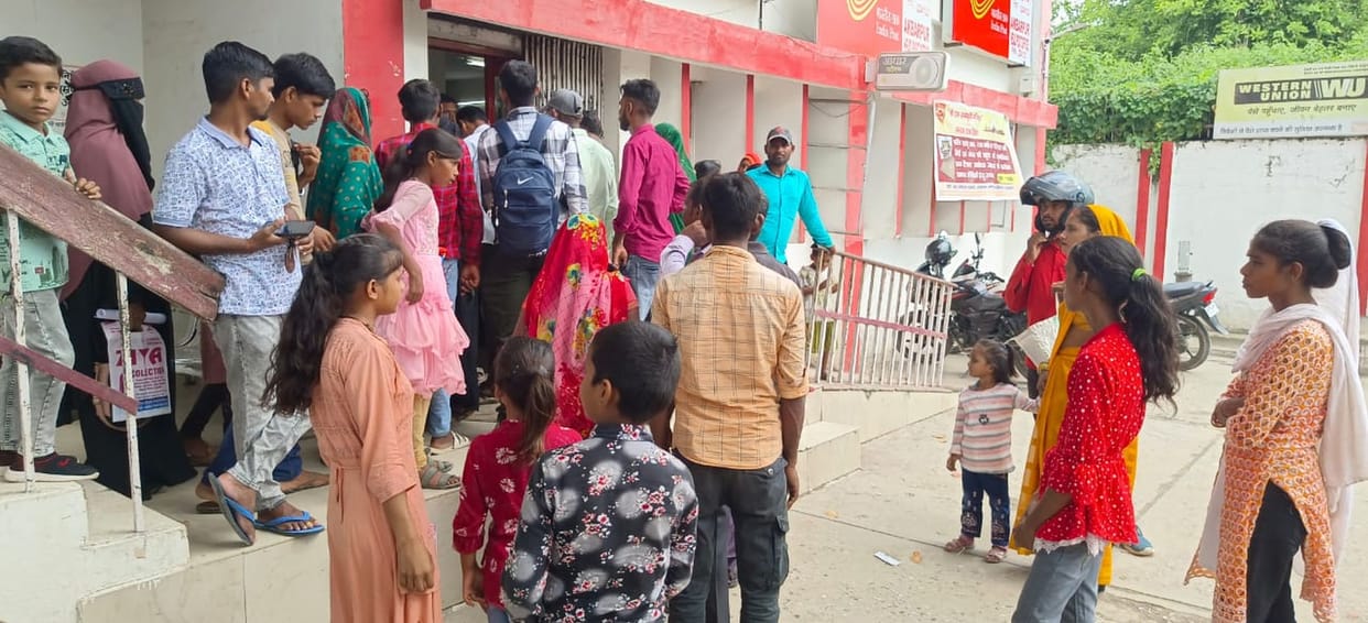 Children left school and stood in line to get Aadhaar card made