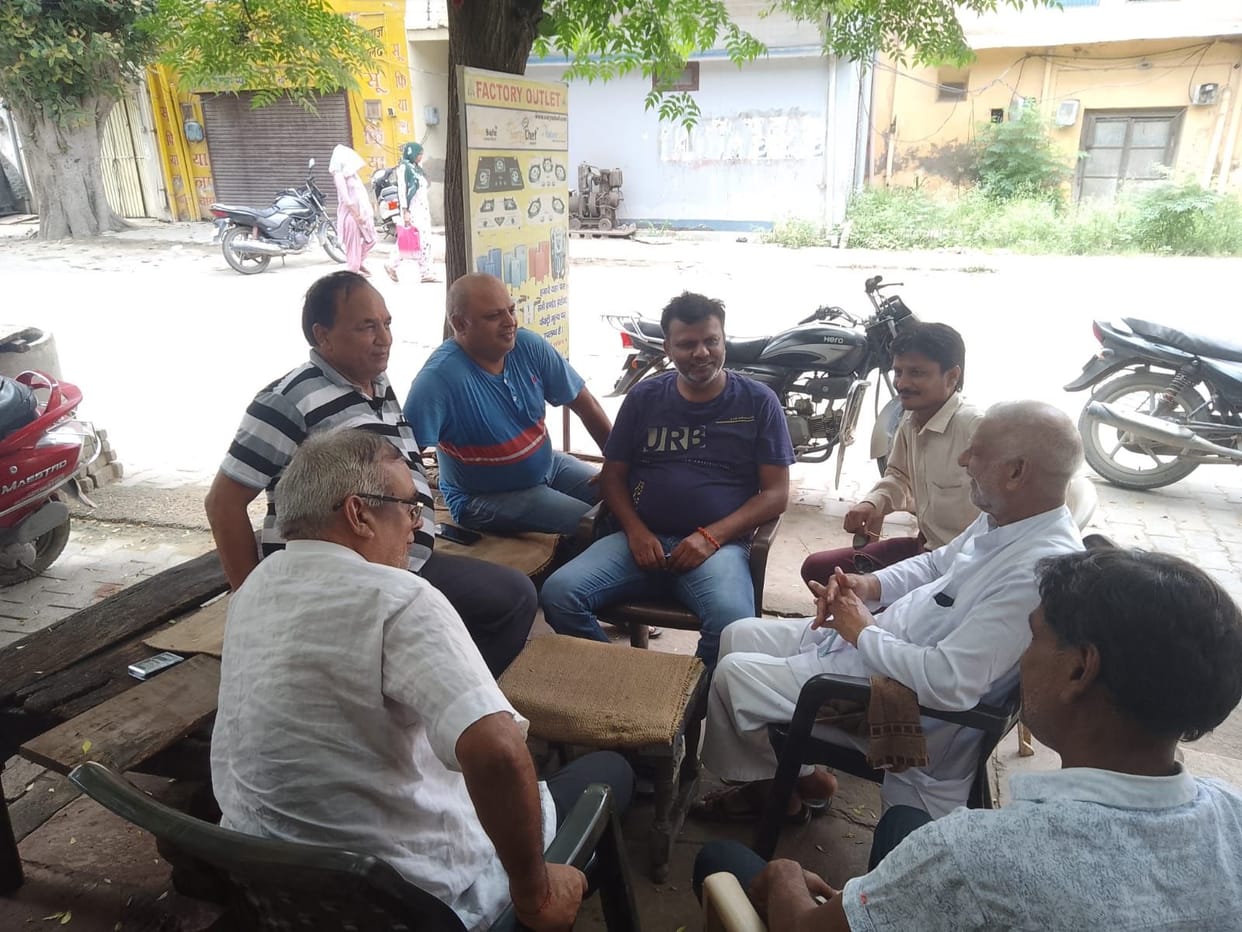 Discussing politics while sipping tea and strolling in the park