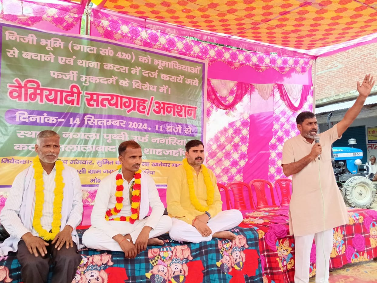 Villagers sitting on fast accusing MP of occupying plot