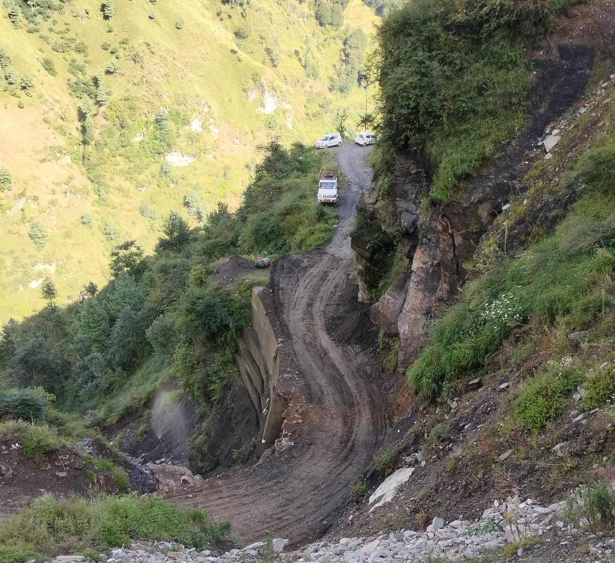 Debris removed with machine, villagers created a riot, then the road was restored