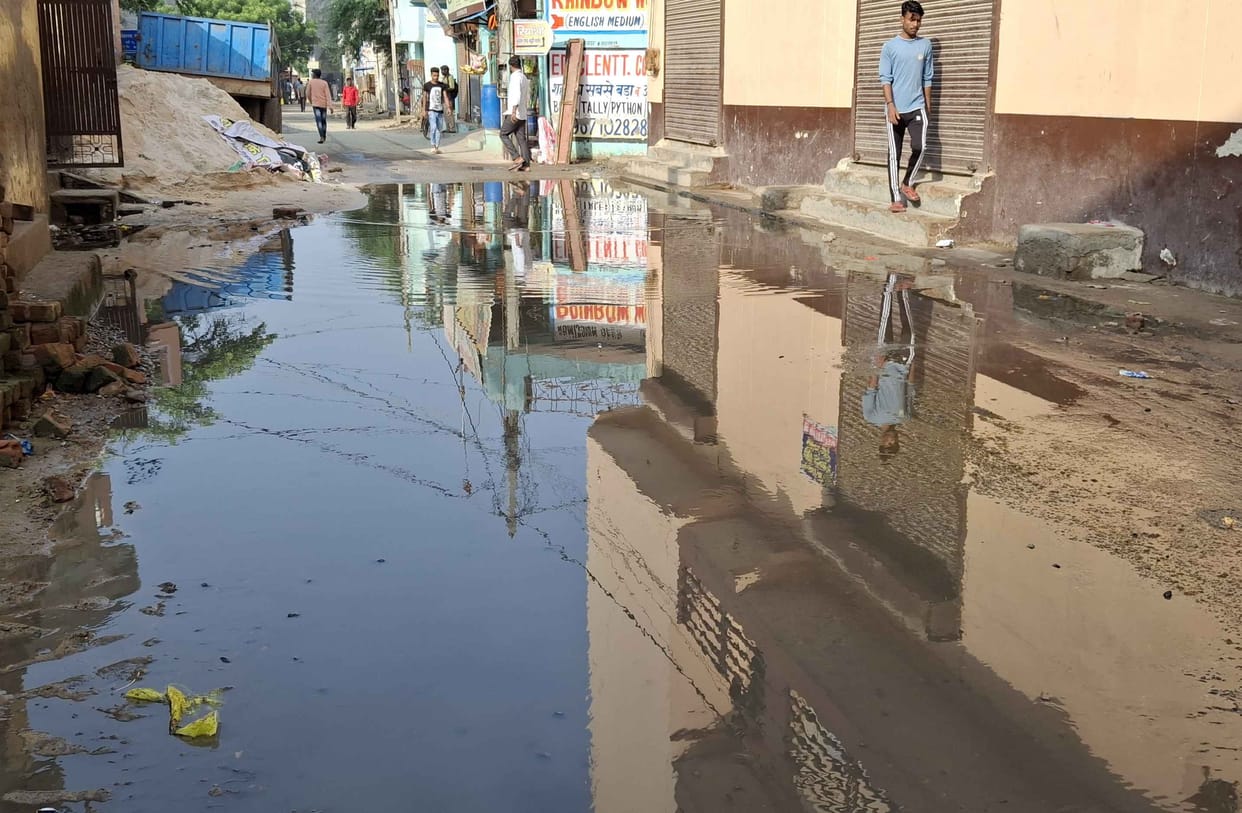 People upset due to sewer overflow in Dharam Vihar Colony