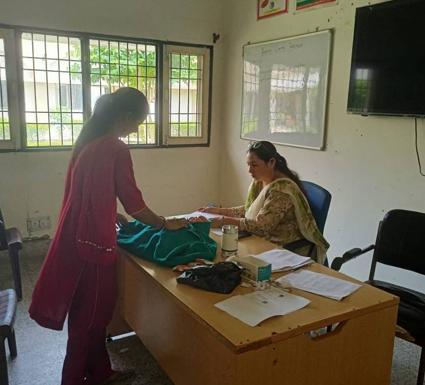 The department will test Asha's knowledge through an exam of 100 marks, if she passes she will get cash.