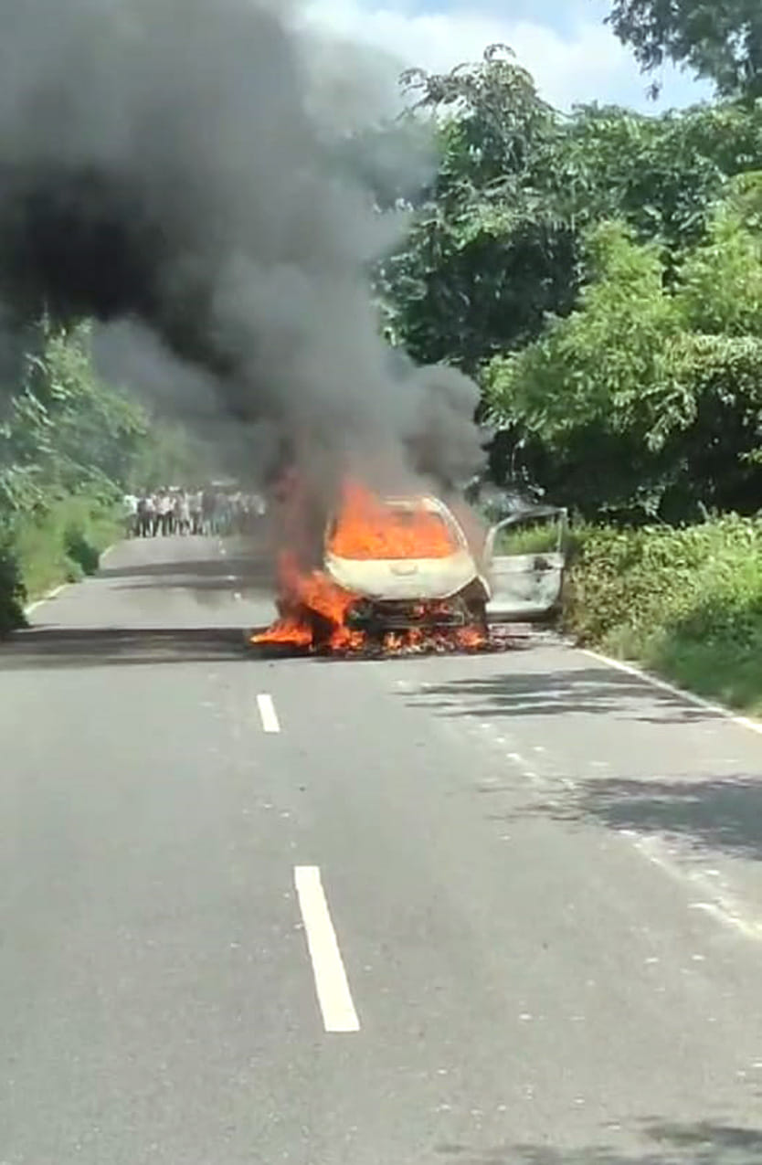 A moving car caught fire on the Badaun-Bijnor highway