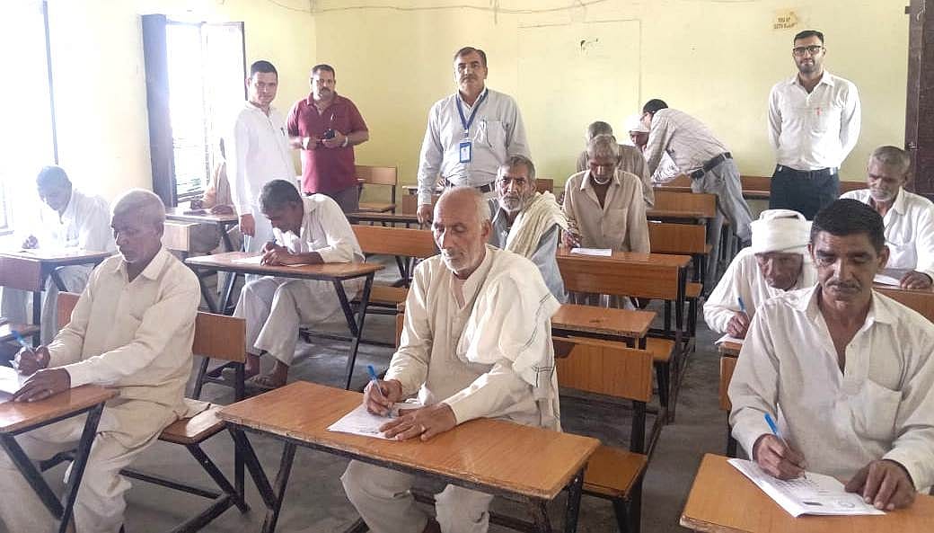 Elders show joy in giving proof of literacy