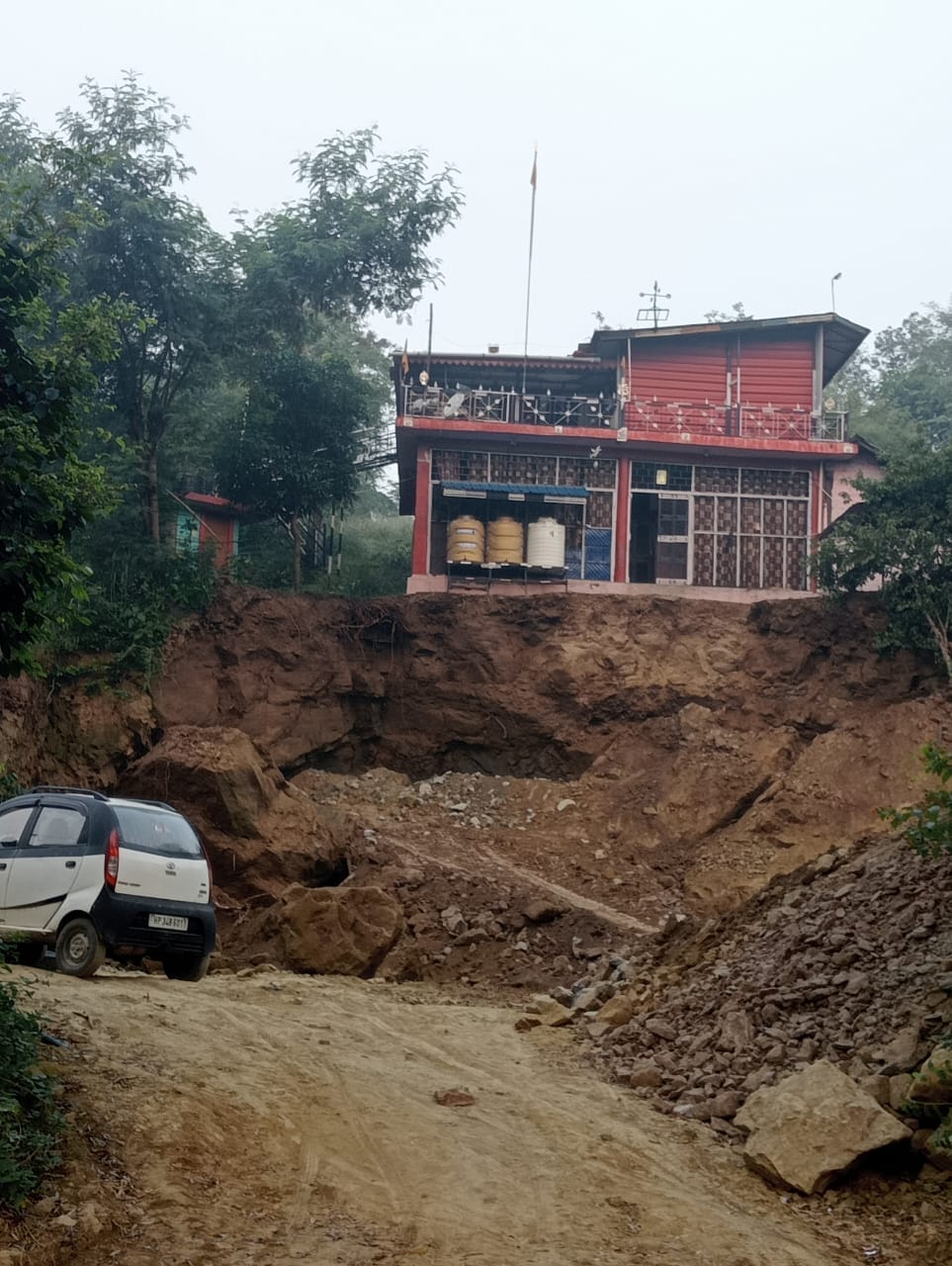 House in danger due to landslide, family forced to spend night in slum