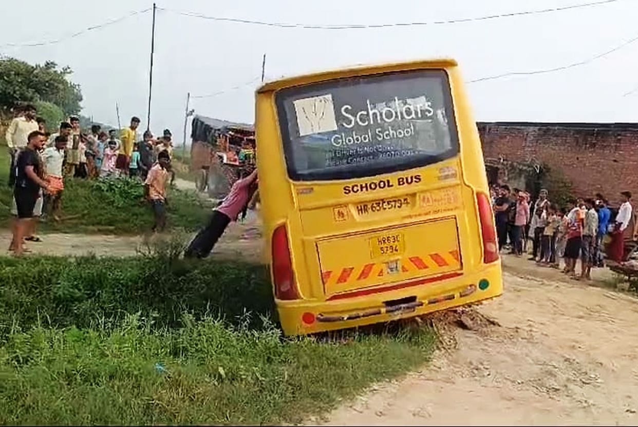 Wheel of school bus lands in drain, children scream