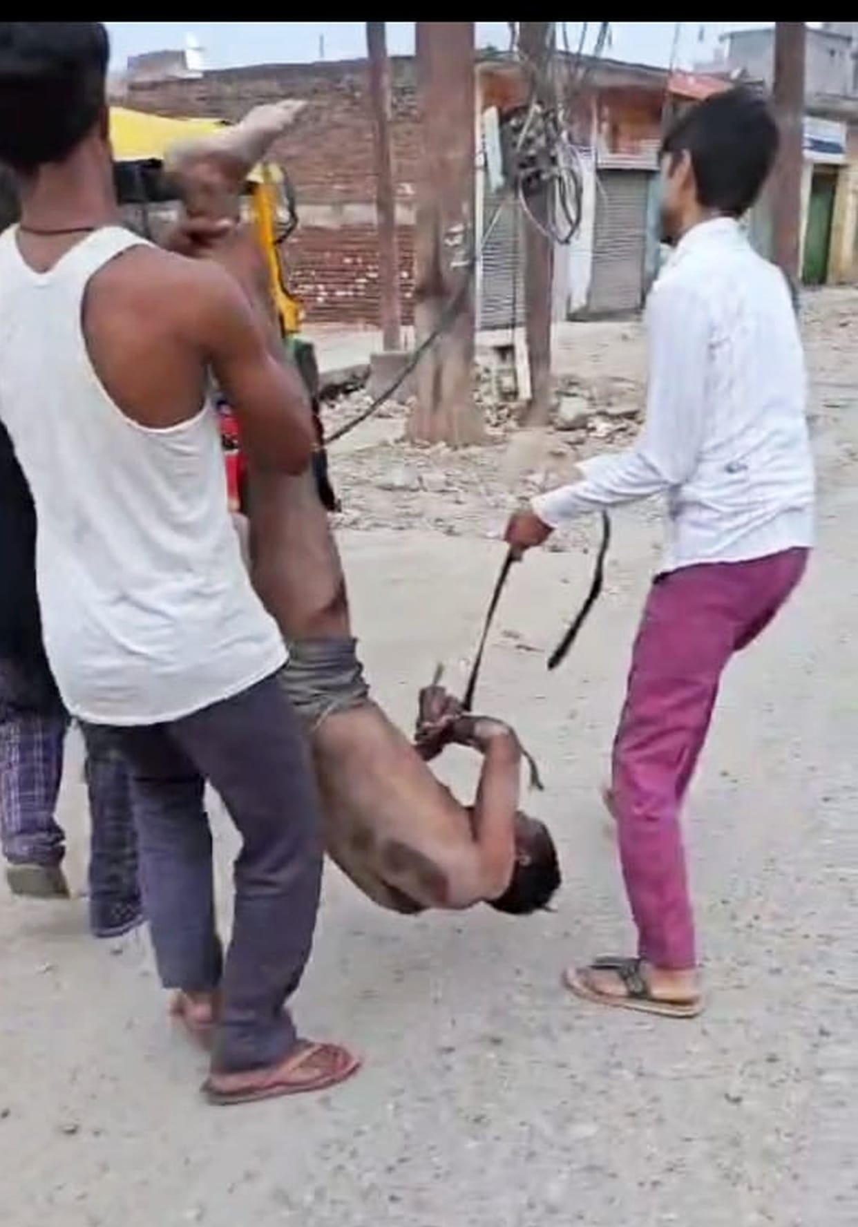 First kidnapped the young man...then tied him to a pillar and beat him