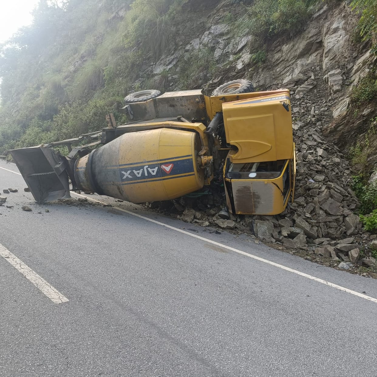 Vehicle going for road repair work overturned, driver injured