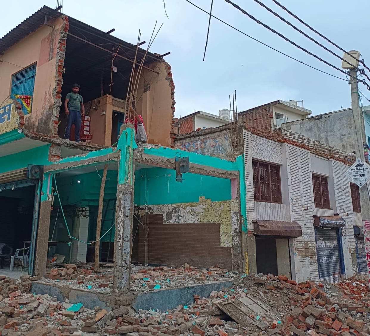 The building owner himself is demolishing the building and collecting the items.