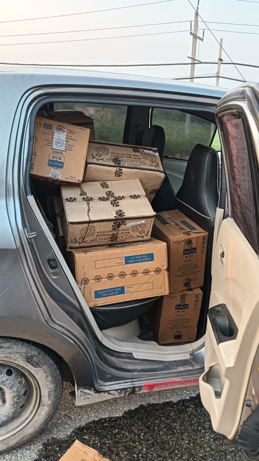 Two accused arrested with liquor in car