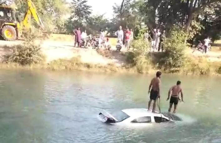 Policeman's car collides with bridge and falls into canal