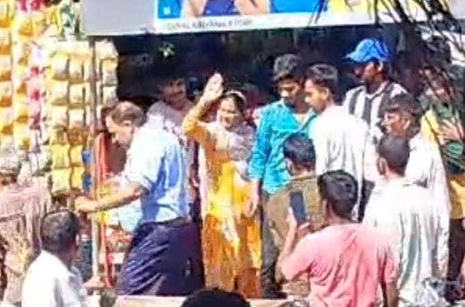 A woman beat up a former sarpanch while he was distributing money
