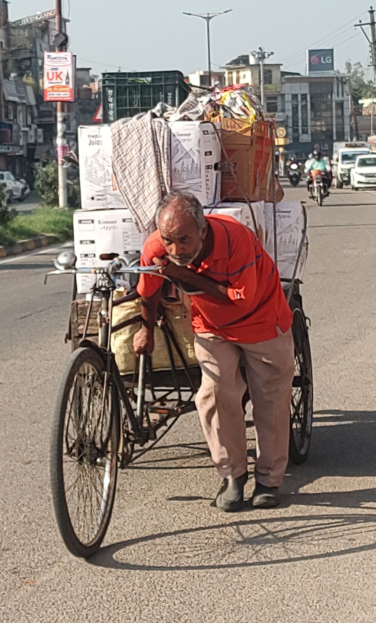 Burden of responsibilities... Young street vendor pushed and gave support to old man