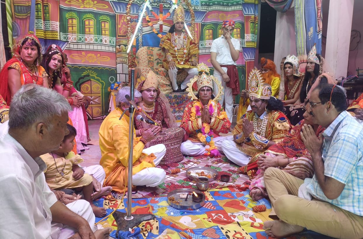 Ram arrived with the wedding procession, Sita garlanded the groom