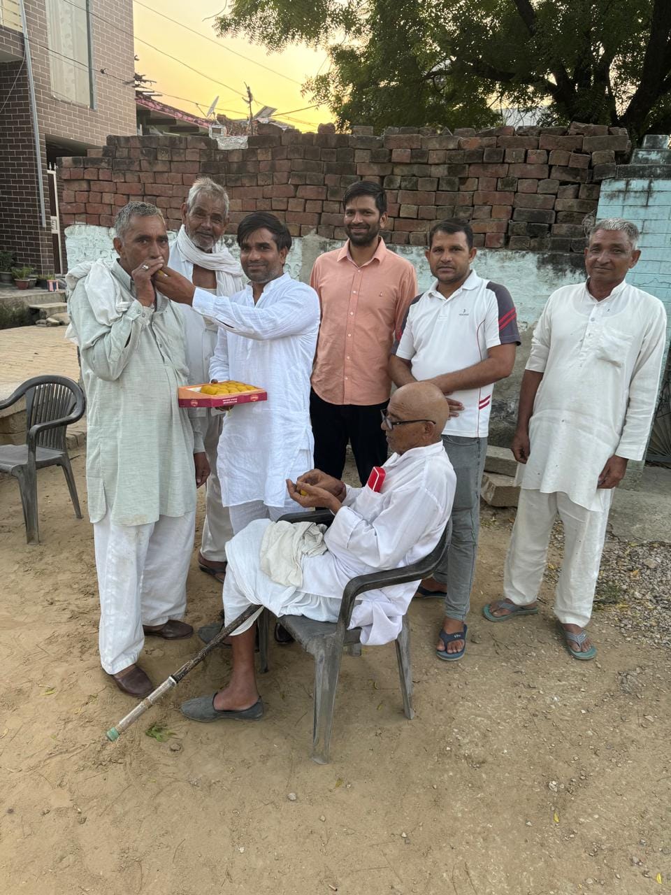 Sweets distributed on BJP's victory in village Khinjuri