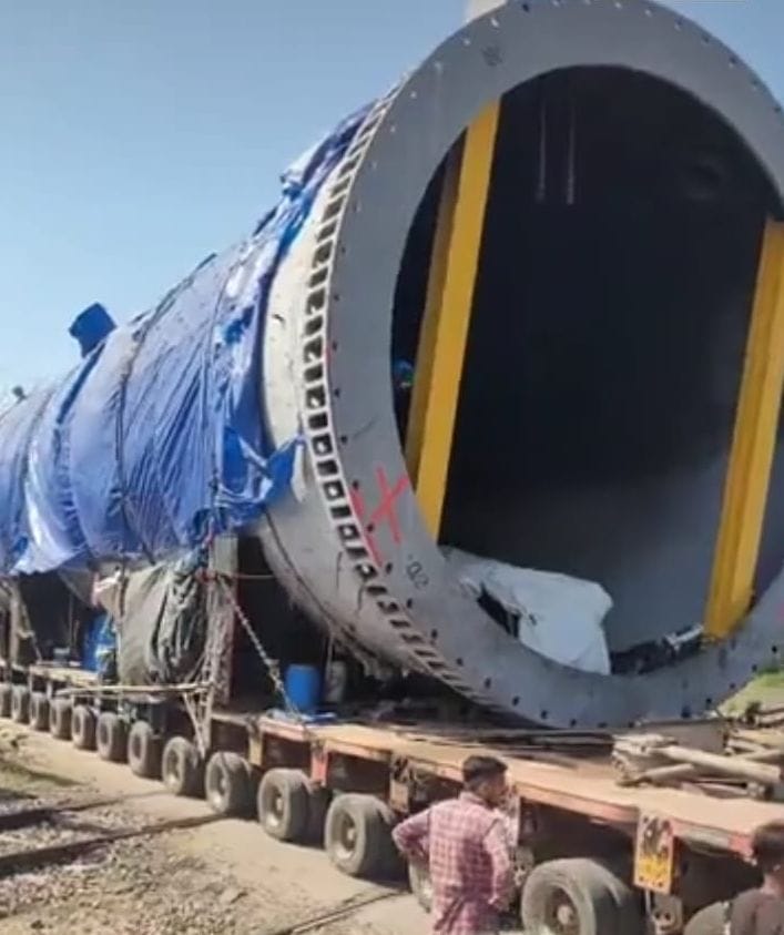 A giant trolley passed through the refinery carrying cylinders.