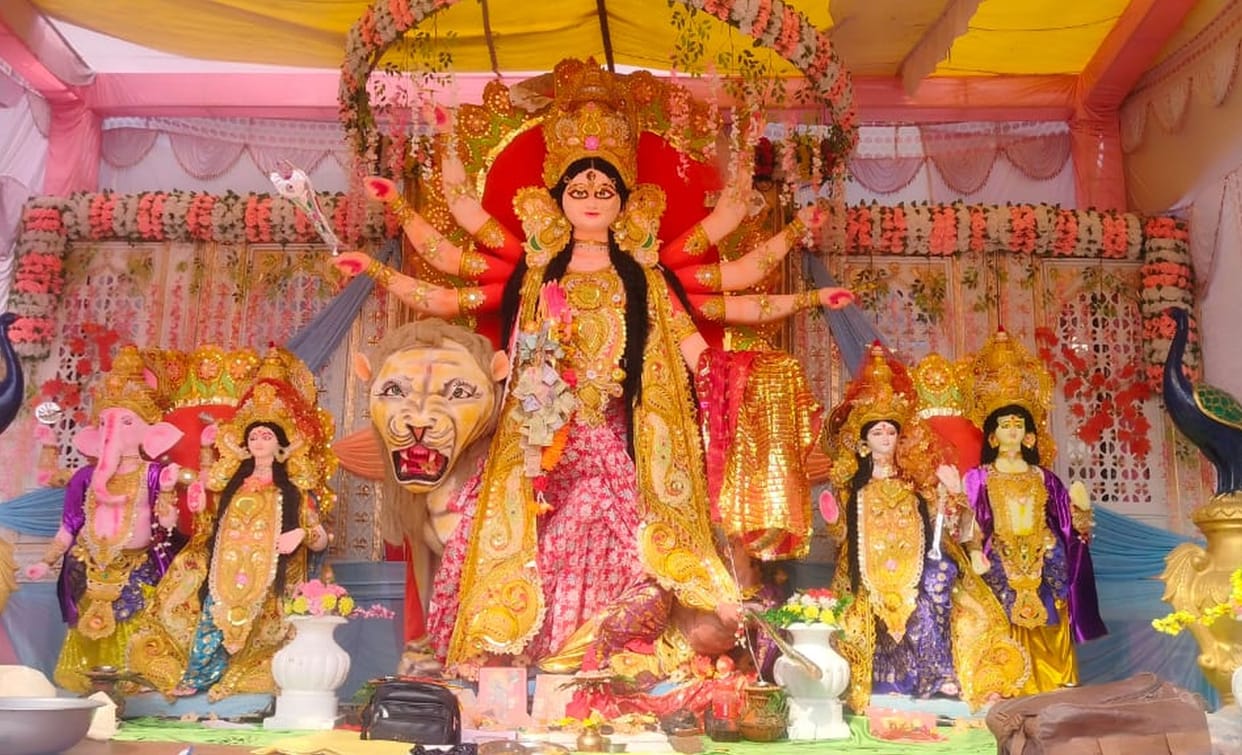 Mother seated in pandals, devotees drenched in faith