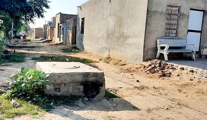 Three feet high manholes in the unpaved streets of Chandan Nagar, vehicular traffic stopped, increased risk of accidents