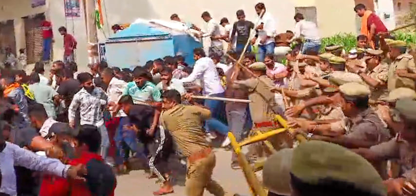 Police batons rained down as soon as the barricade fell