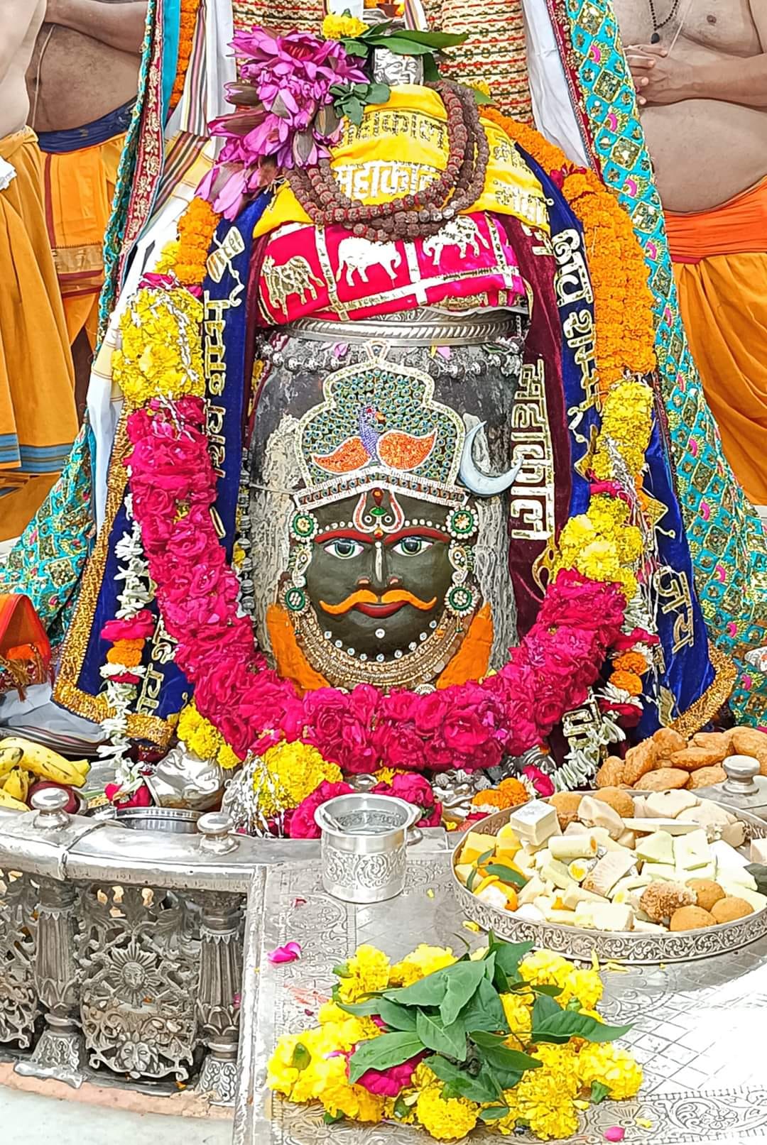 Baba Mahakal adorned in Bhasma Aarti wearing a garland of Rudraksh and roses