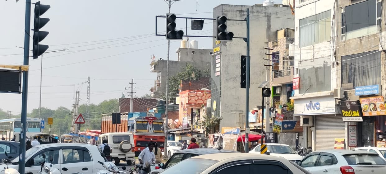 All three traffic lights on the highway are playing hide and seek
