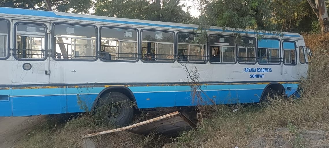 Bus collides with divider and lands in pit, two passengers injured