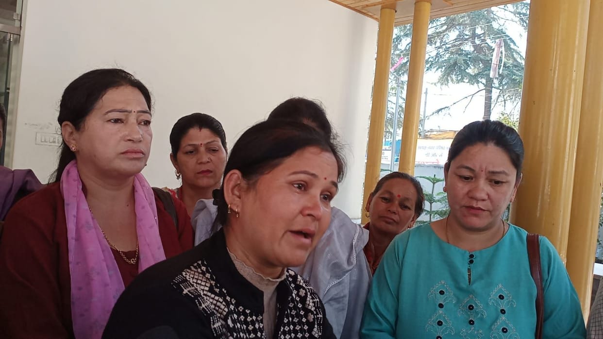 Tears welled up in Vidya Devi's eyes outside DC office.