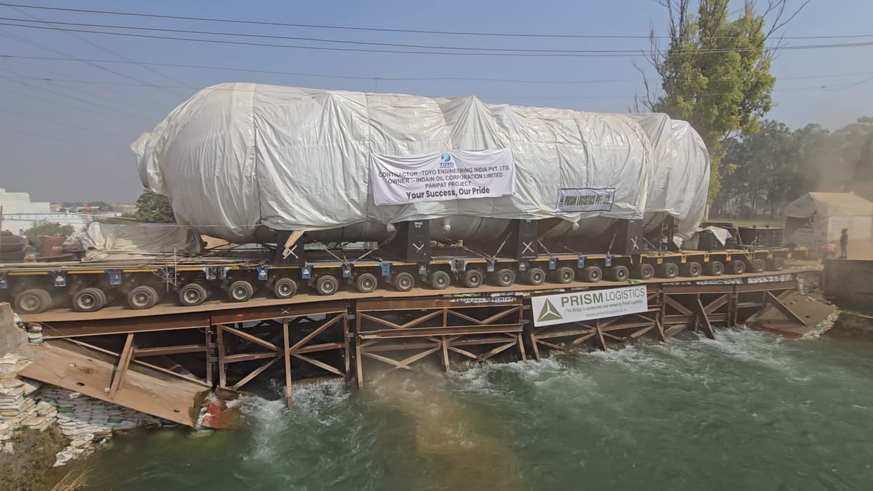 Two huge cylinders were passed through the temporary bridge constructed on the canal