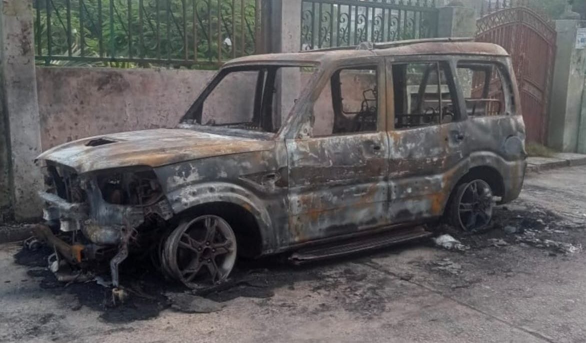 A car parked in front of the park suddenly caught fire