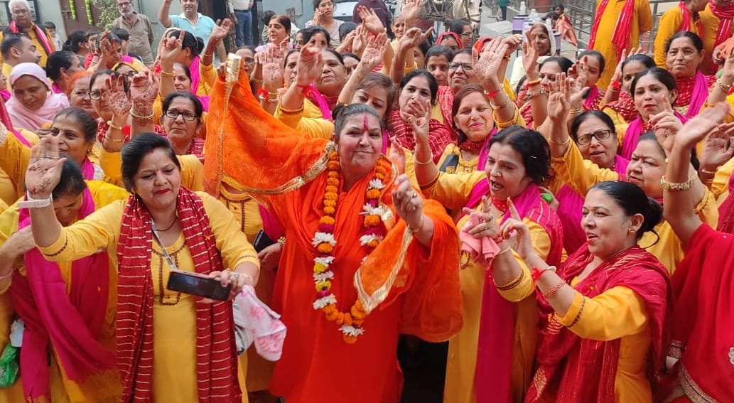 Devotees dance in Shaligram procession