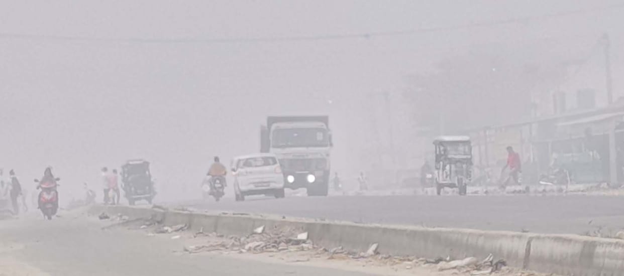 Morning surrounded by fog... vehicles running with lights on