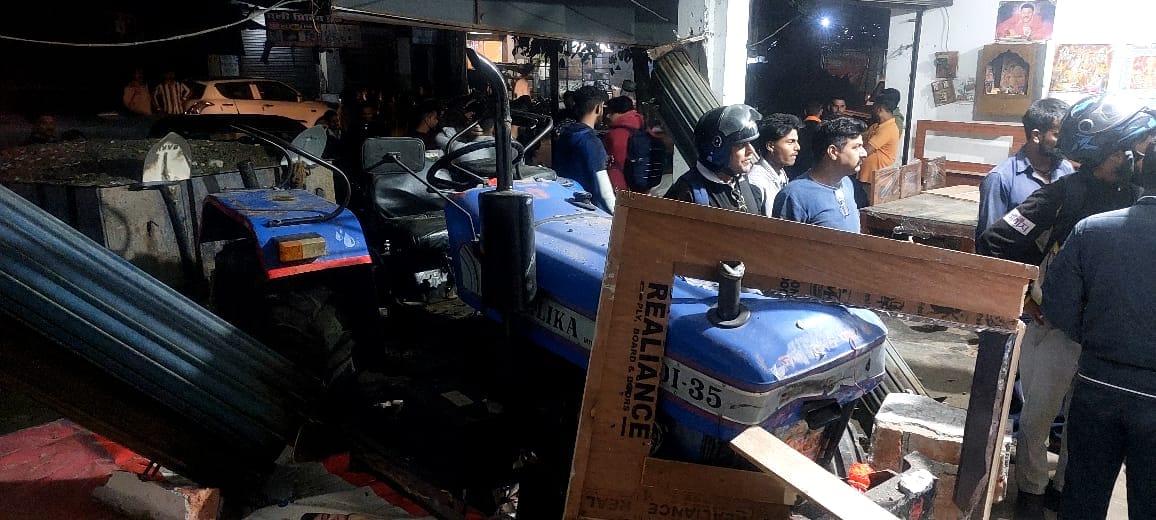 Uncontrolled tractor hits three vehicles and enters furniture shop