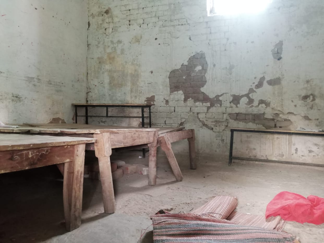 School building on the verge of collapse, officers sitting with closed eyes
