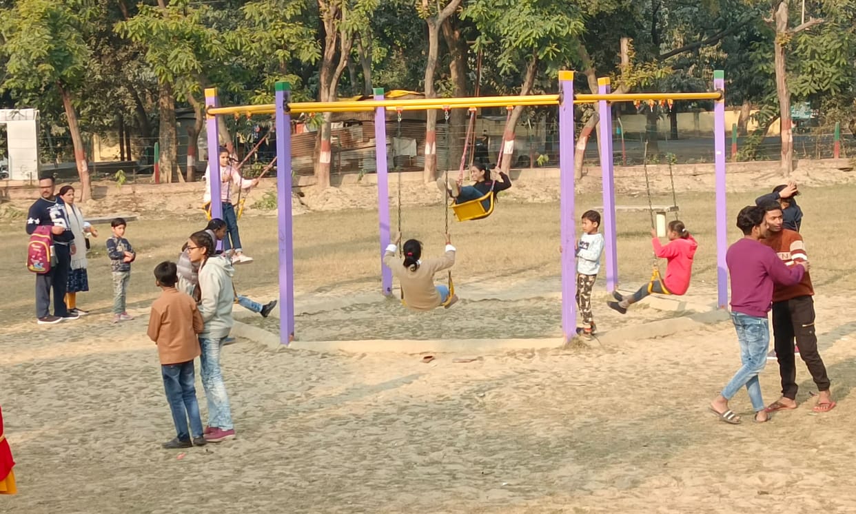Children enjoying the sunshine in Buddha Park of the city.